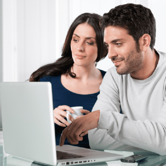 Couple with internet laptop