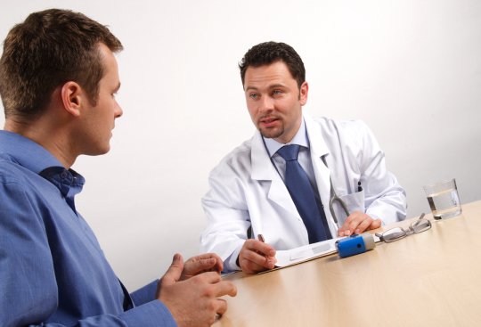 doctor talking with patient