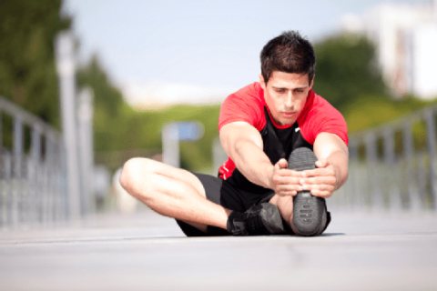 Athlete Performing Warmup and Stretching to Avoid Inury